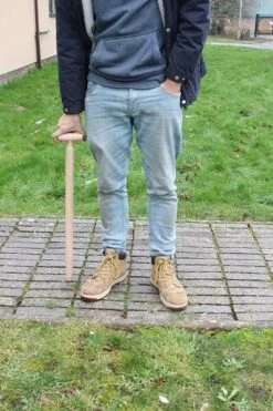 Long Handled Wooden Dibber -Outdoor Garden Care Shop long handled plant dibber in use